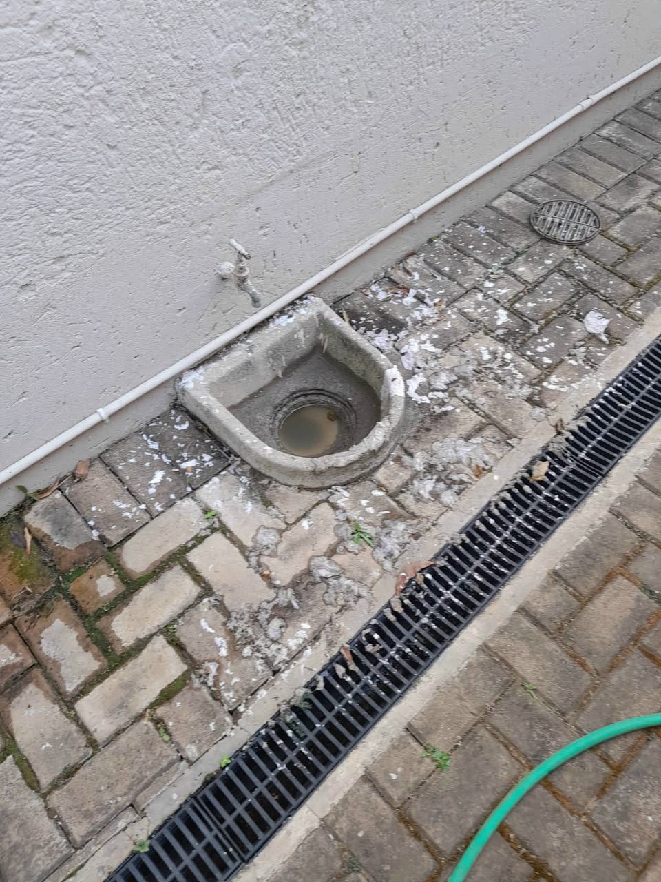 Plumber using a drain snake